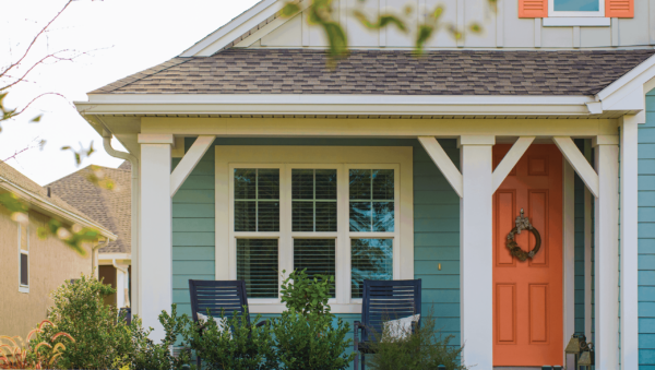 Home with blue vinyl and 3 windows