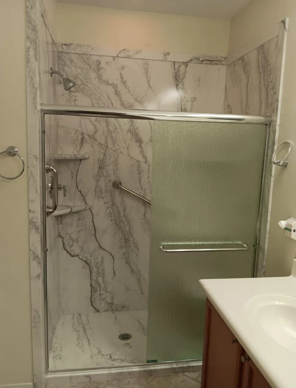 Schaffer Family in Buckeye, AZ with a top of the line Shower Replacement in White Pearl with chrome fixtures.