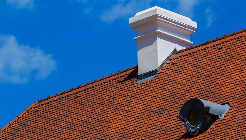 Red Tile Roof with Stucco Chimney With Apron Flashing
